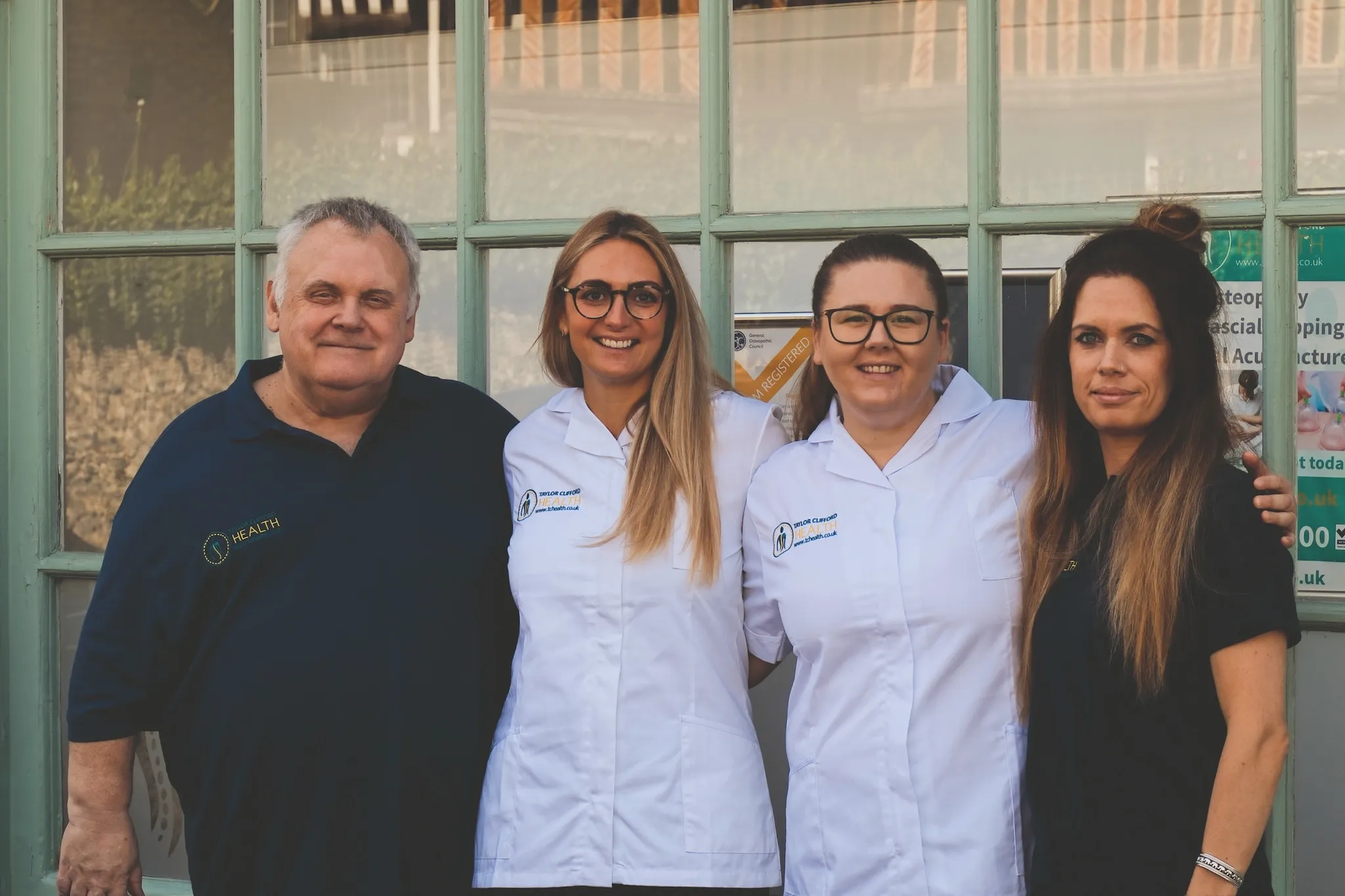 The Taylor Clifford Health team outside the Charing clinic: Martin, Laurel, Holly, and Shani